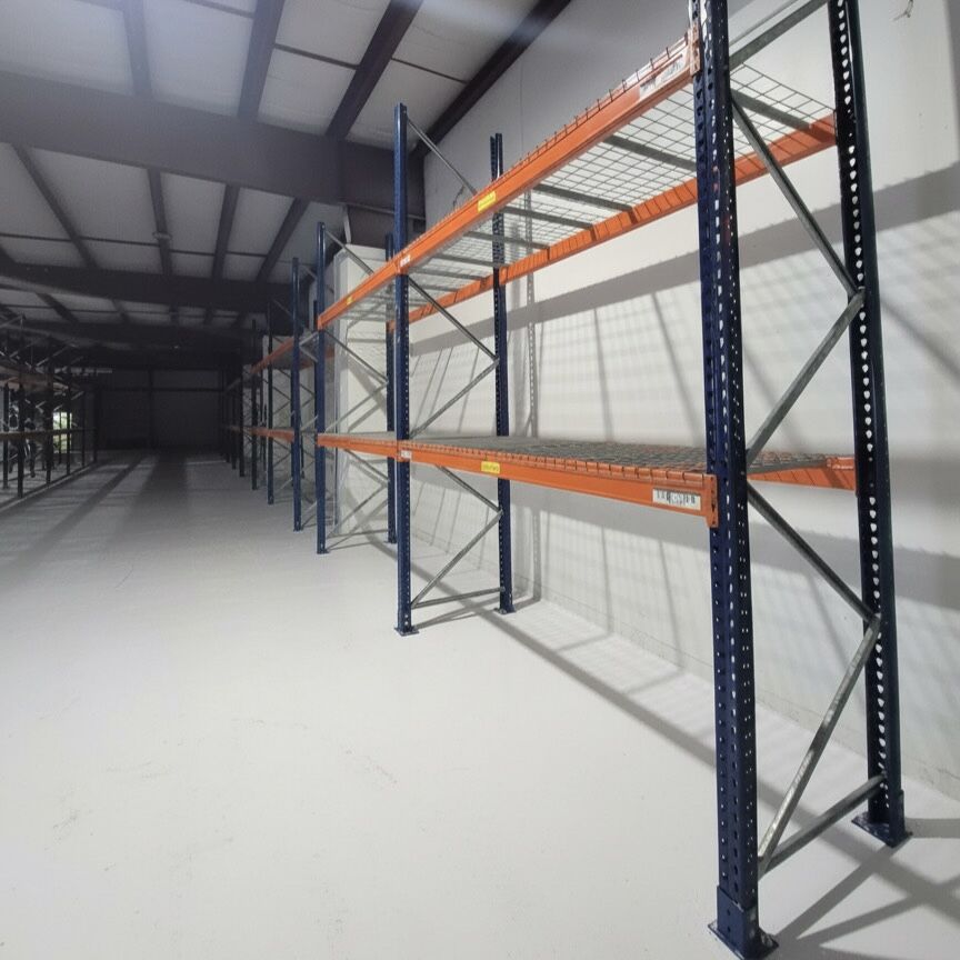 Row of Pallet Racking with standard waterfall wire mesh decks for the shelves